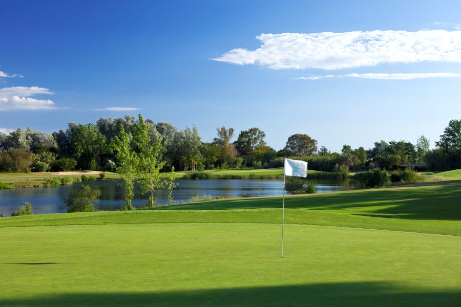 Flag on green at Dom Pedro Laguna Golf Course in the Algarve