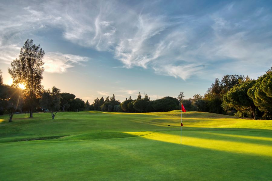 Red flag on putting green at Dom Pedro Millennium Golf Course