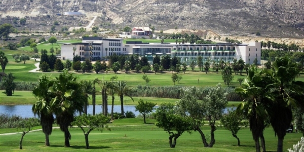 Exterior of Hotel La Finca Golf And Spa with golf course, lake and palm trees in the foreground