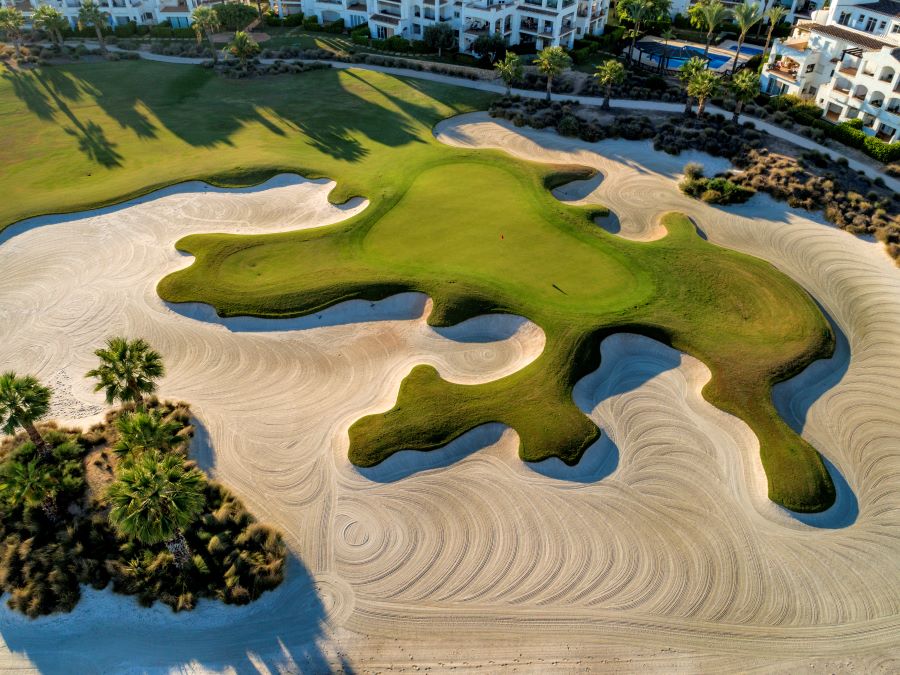 Huge sand trap surrounding the putting green at La Torre golf course
