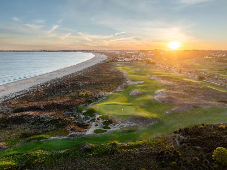 Sun rising over the coast and the golf course at Palmares Ocean and Living Golf Club