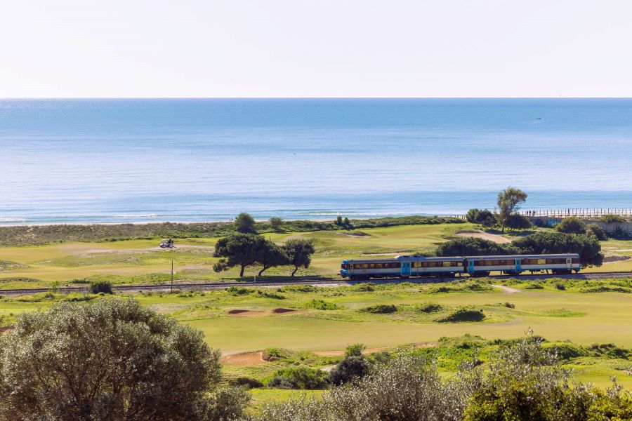 Train running through the golf course at Palmares Ocean and Living Golf Club