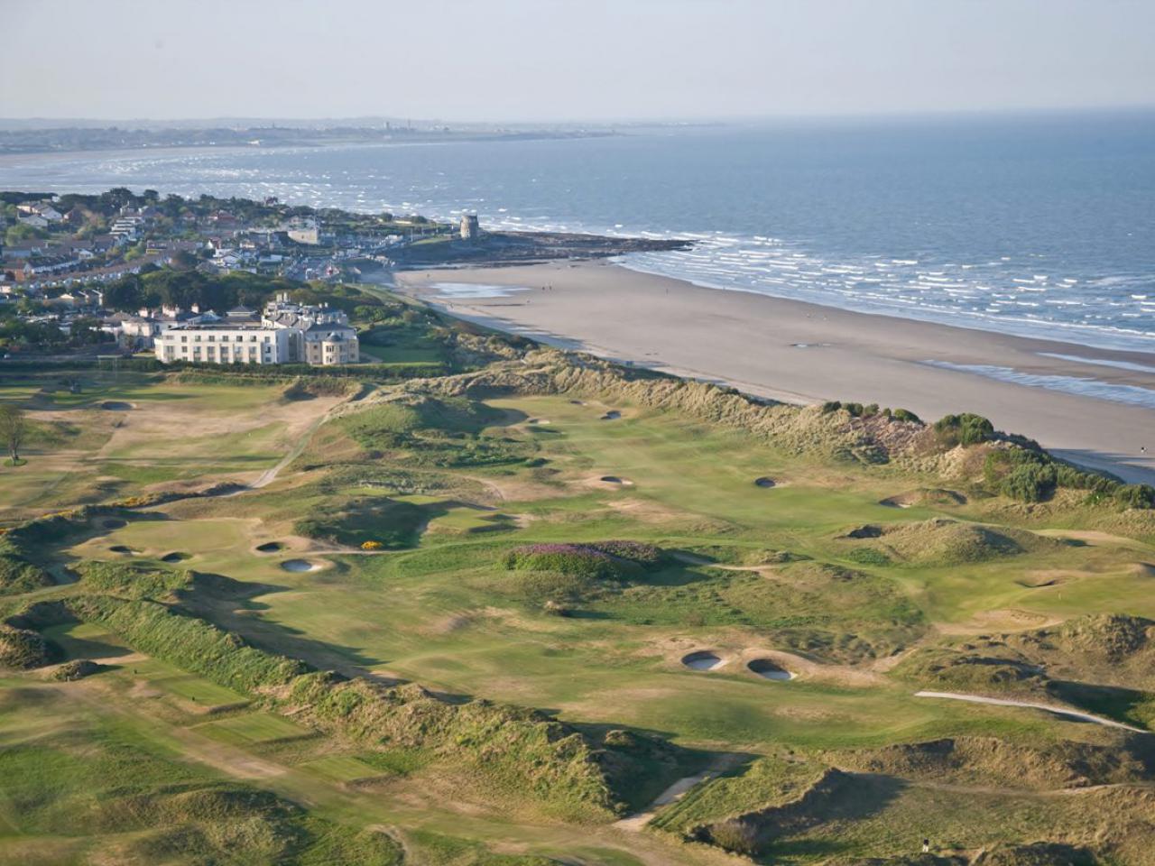 Golf course with bunkers, beach and sea at Portmarnock Hotel and Golf Links