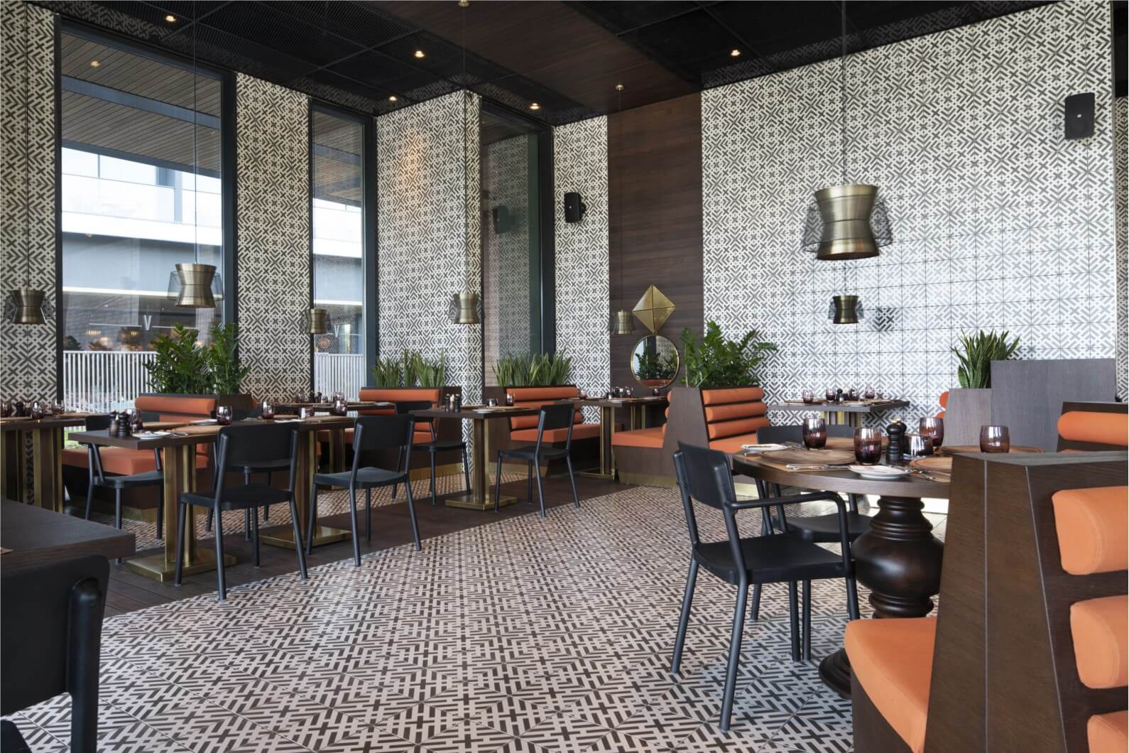 Restaurant at Voyage Belek Golf And Spa Hotel with tables set ready for guests