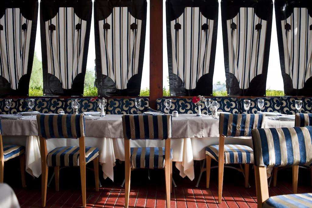 Table laid for guests in one of the restaurants at Cornelia Deluxe Resort