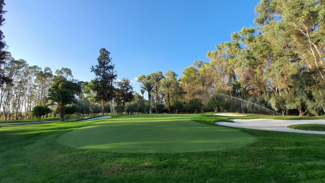 Putting green with flag at Royal Golf Marrakech
