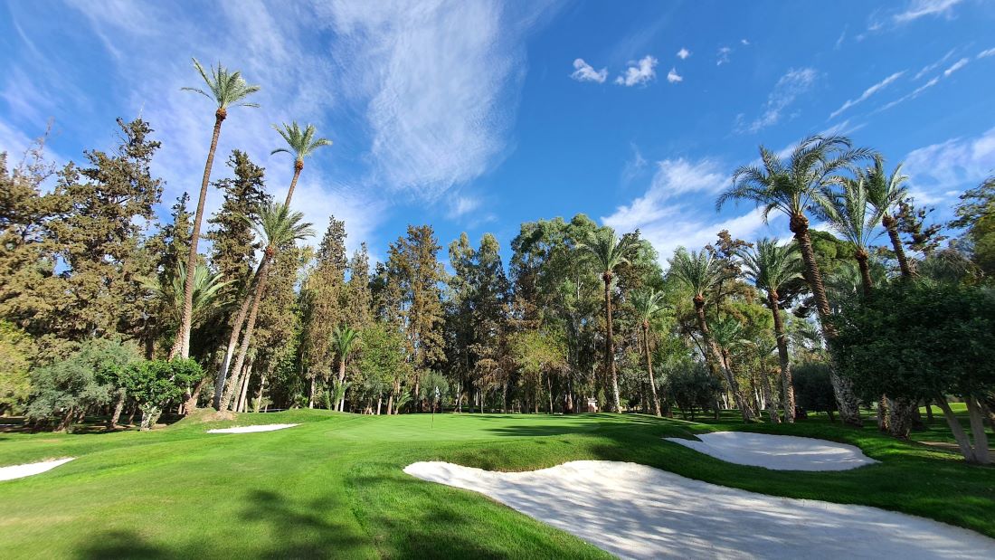 Royal Golf Marrakech with bunkers and trees surrounding the green