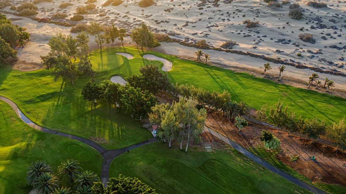 Maspalomas Golf course in Gran Canaria from the air, showing fairway and sand to the side of it