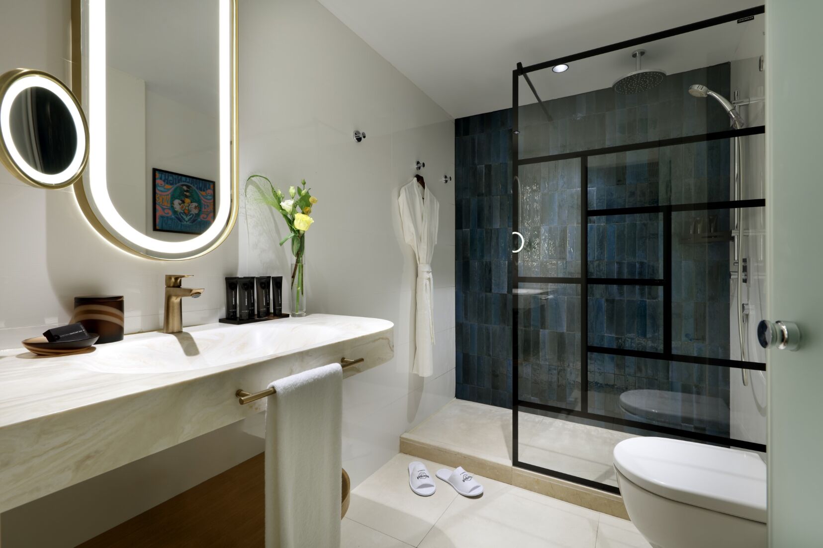 Bathroom at Hard Rock Hotel Marbella with mirror, sink, toilet and shower