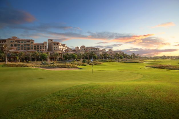 View of Saadiyat Beach Golf Club at sunset, overlooking the accommodation