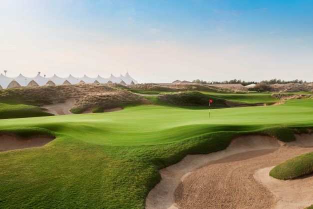 Yas Links Golf Club with bunker in the foreground