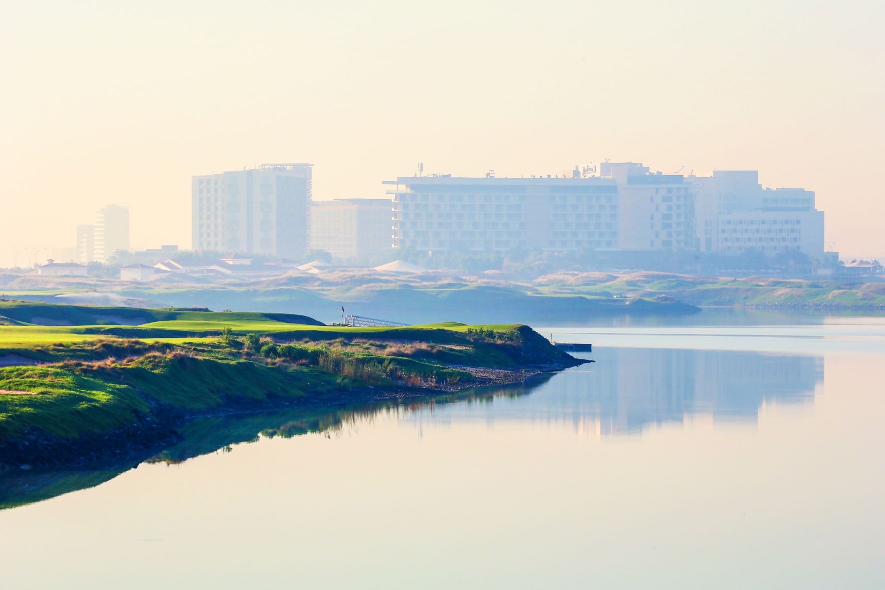 Yas Links Golf Club with Abu Dhabi in the distance