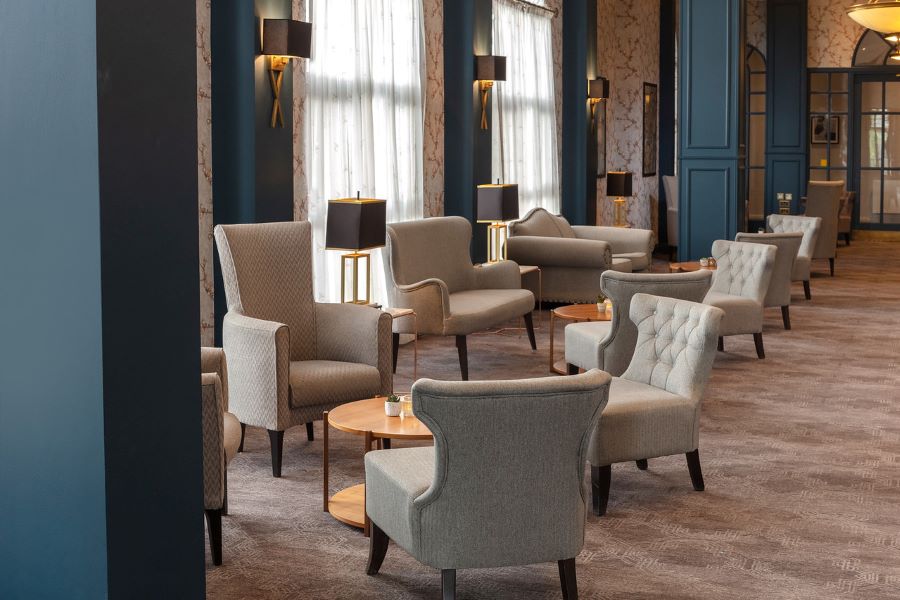 Grey armchairs in bar area at Belton Woods Hotel, Spa And Golf Resort
