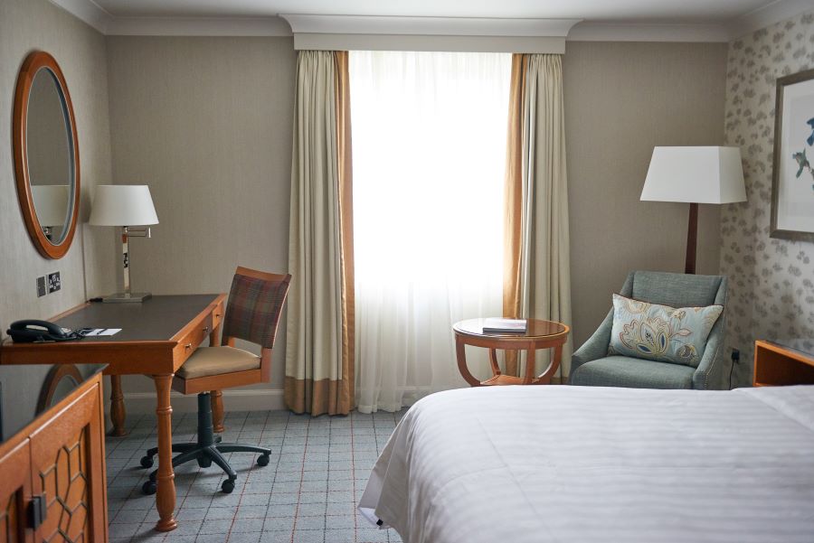 Bedroom at Dalmahoy Hotel And Country Club with desk and chair