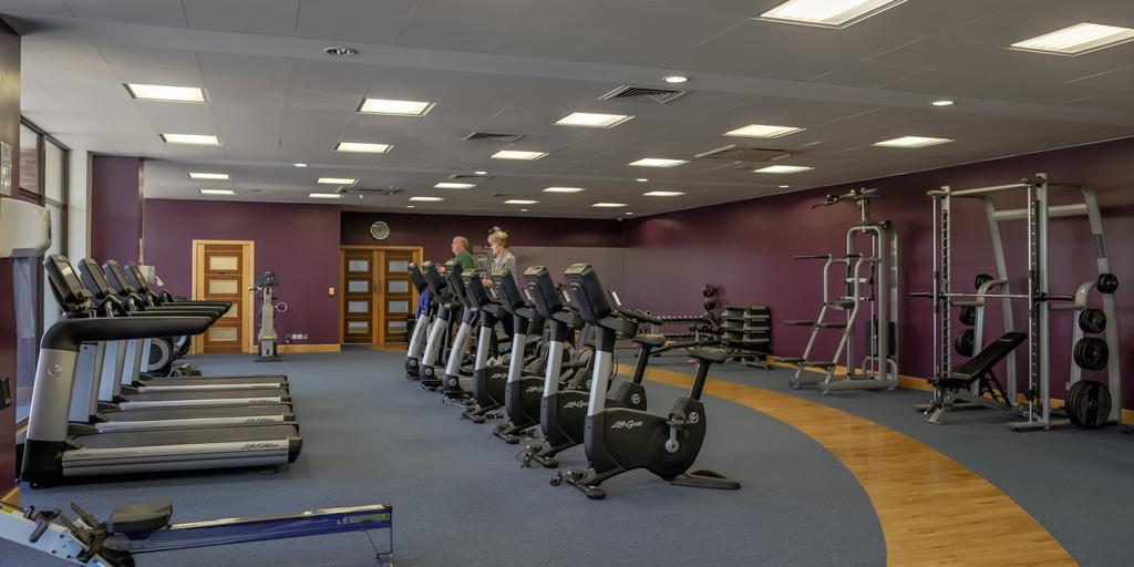 Guests on the cardio machines in the gym at East Sussex National