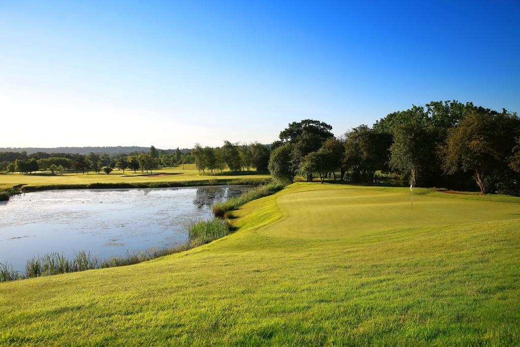 Lake to the left of the green on the golf course at Belton Woods