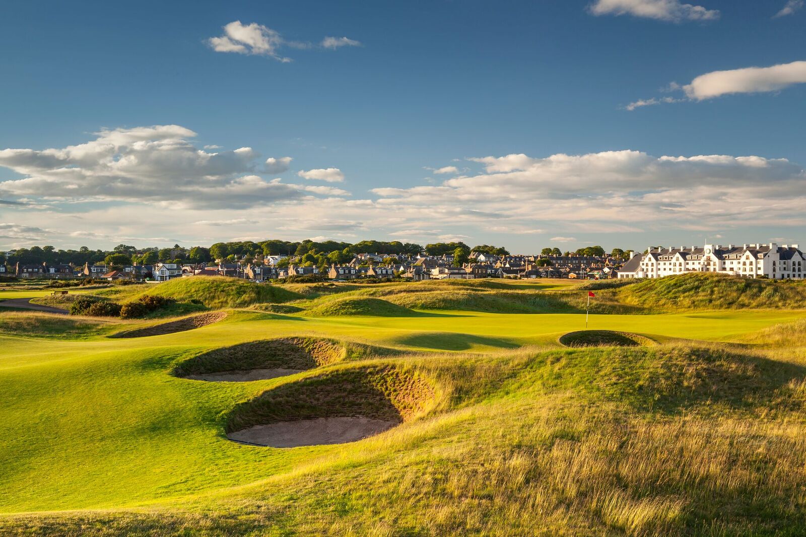 View of the course with the town and the resort in the distance at Carnoustie Golf Hotel And Spa