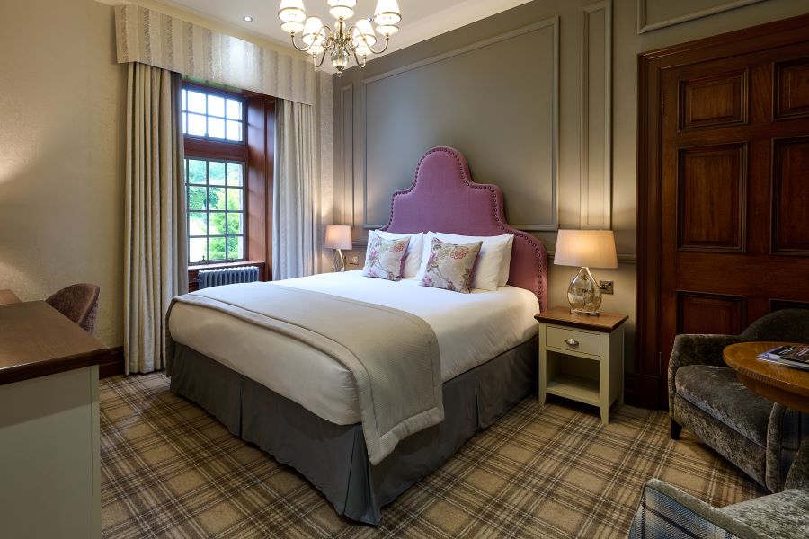 Double bedroom with tartan carpet at Murrayshall Country Estate