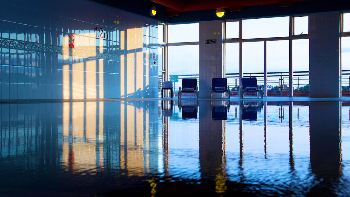 Indoor heated swimming pool and loungers at Carnoustie Golf Hotel And Spa