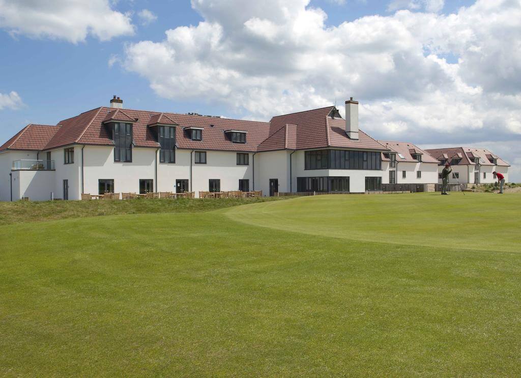 External view of Prince's Golf Club overlooking two golfers on the green