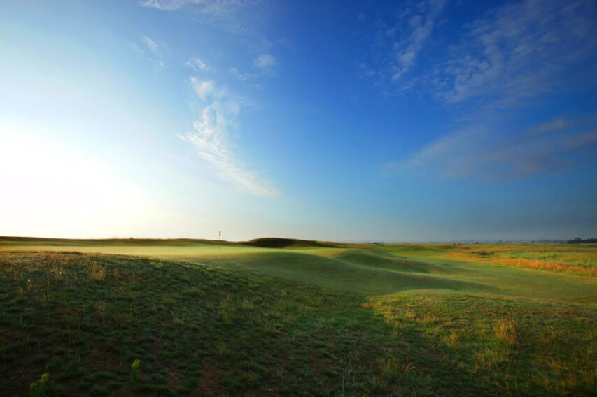 The flag on the green of the golf course at Prince's Golf Club