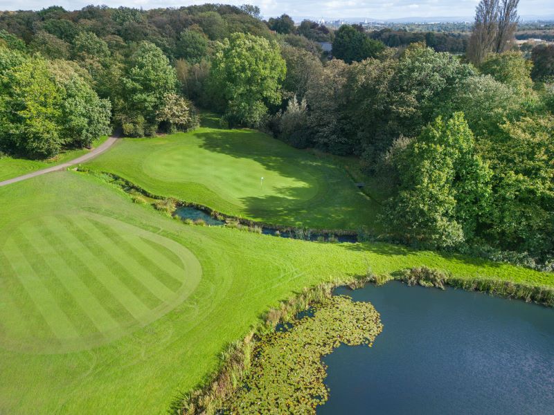 Lake to the right of the green at Delta Hotels by Marriott Worsley Park Country Club