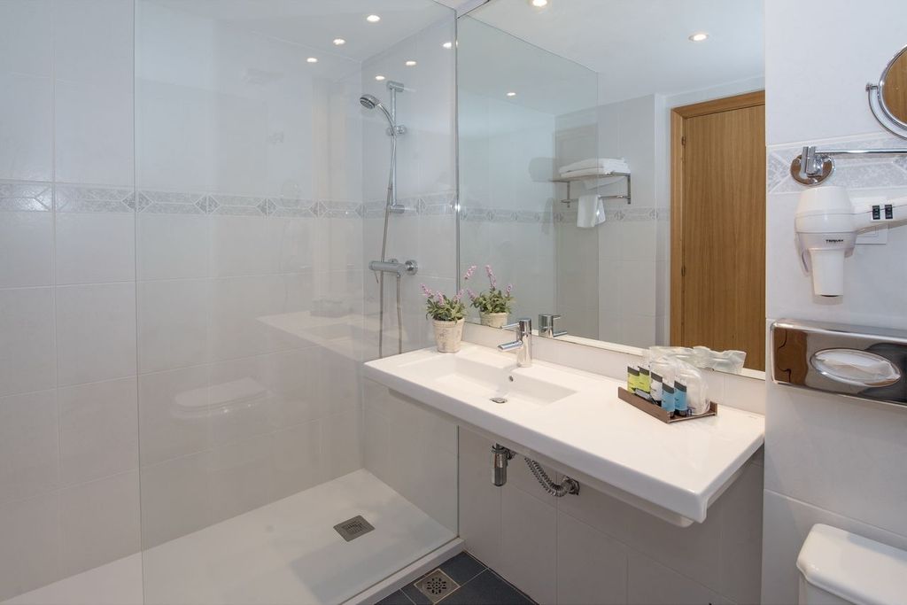 Bathroom with shower cubicle and sink at La Costa Golf and Beach Resort