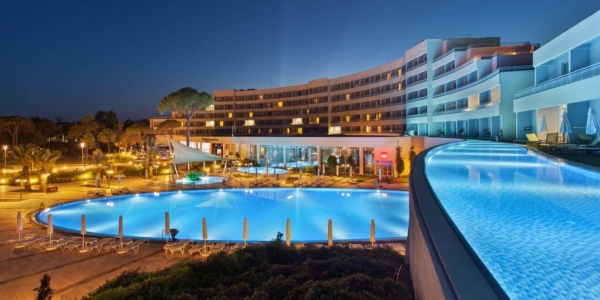 Sentido Zeynep Golf And Spa at night overlooking the swimming pool