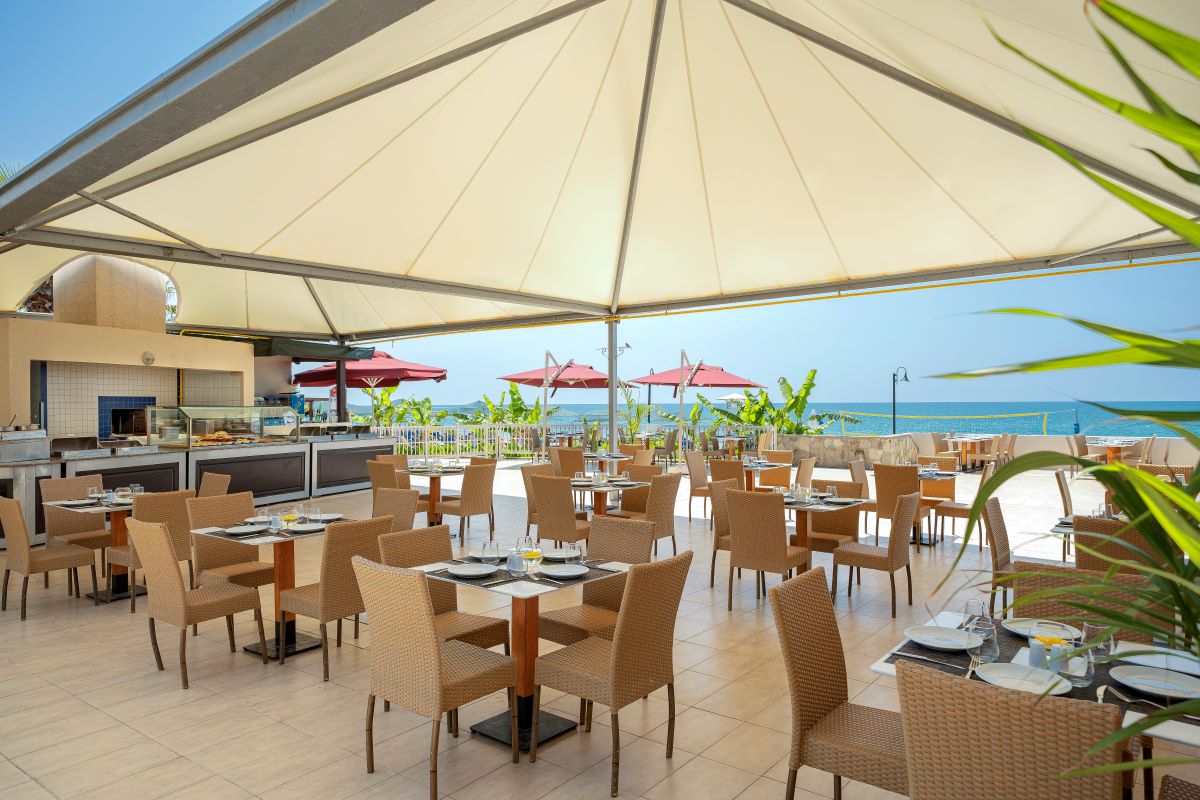Outdoor dining and seating area at Kaya Belek Hotel