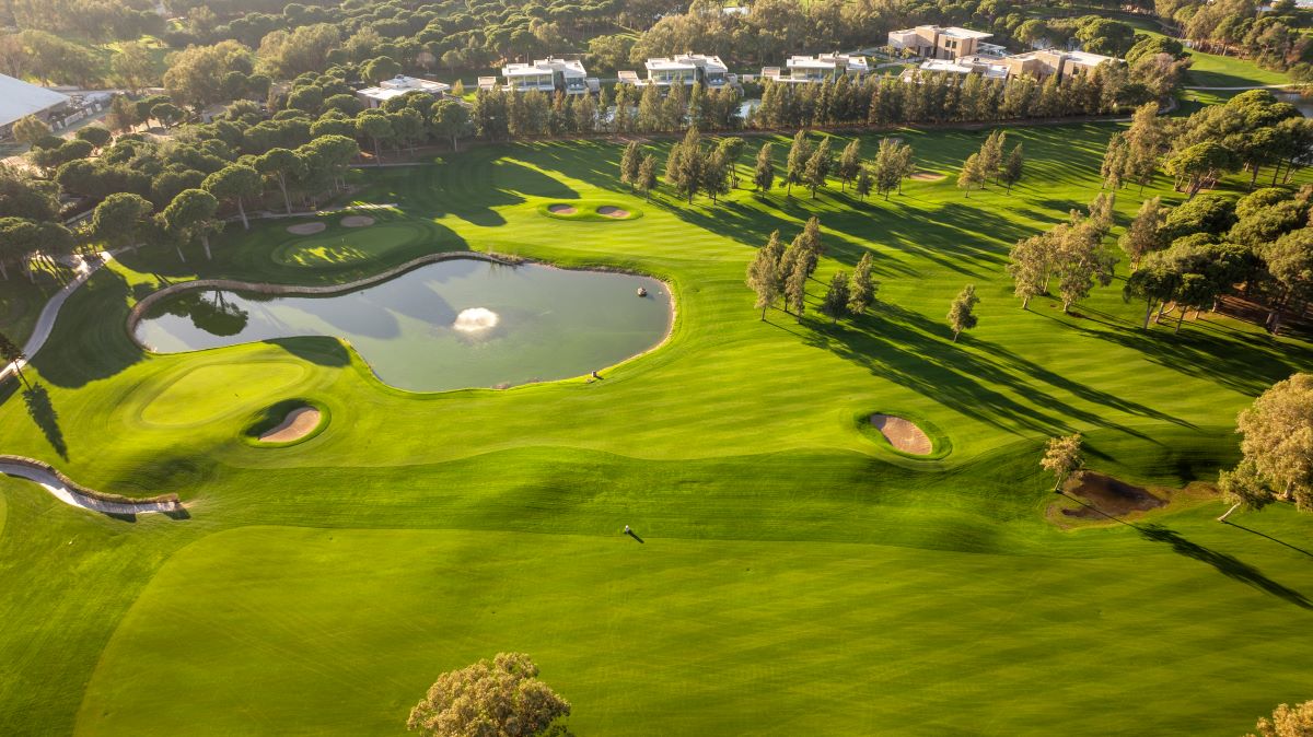 Lake and villas lining one side of the golf course