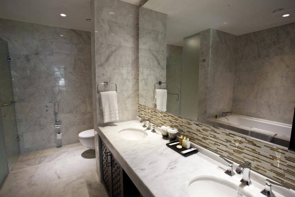 Private bathroom with twin sinks and large mirror at Kaya Palazzo Golf Resort