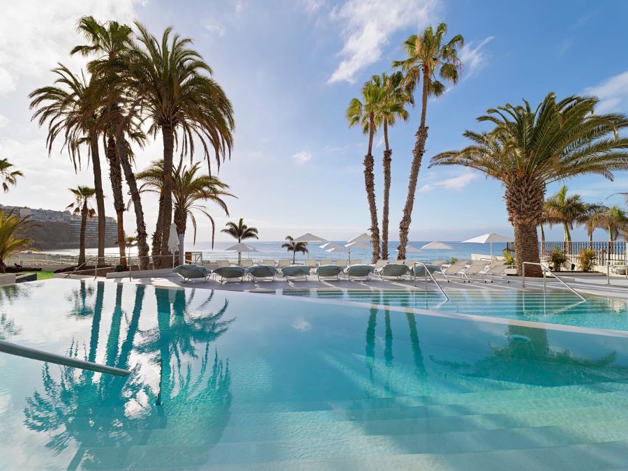 Swimming pool with palm trees at Paradisus by Melia Gran Canaria