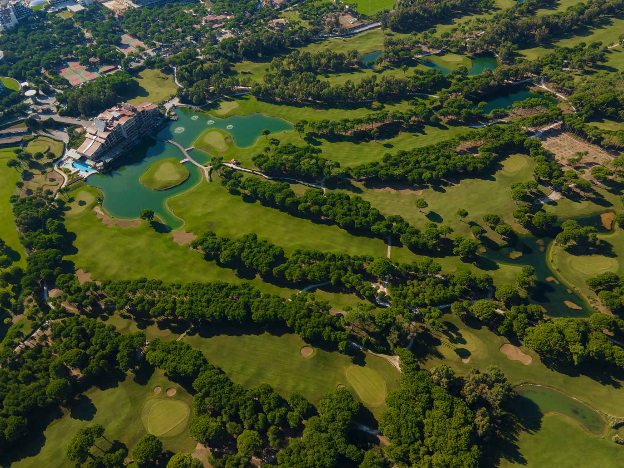 Ariel shot of the tree lined golf courses at Sueno Golf Hotel Belek
