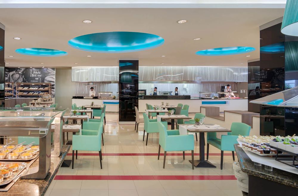 Green chairs in the restaurant of this Gran Canaria hotel - H10 Playa Meloneras Horizons Collection