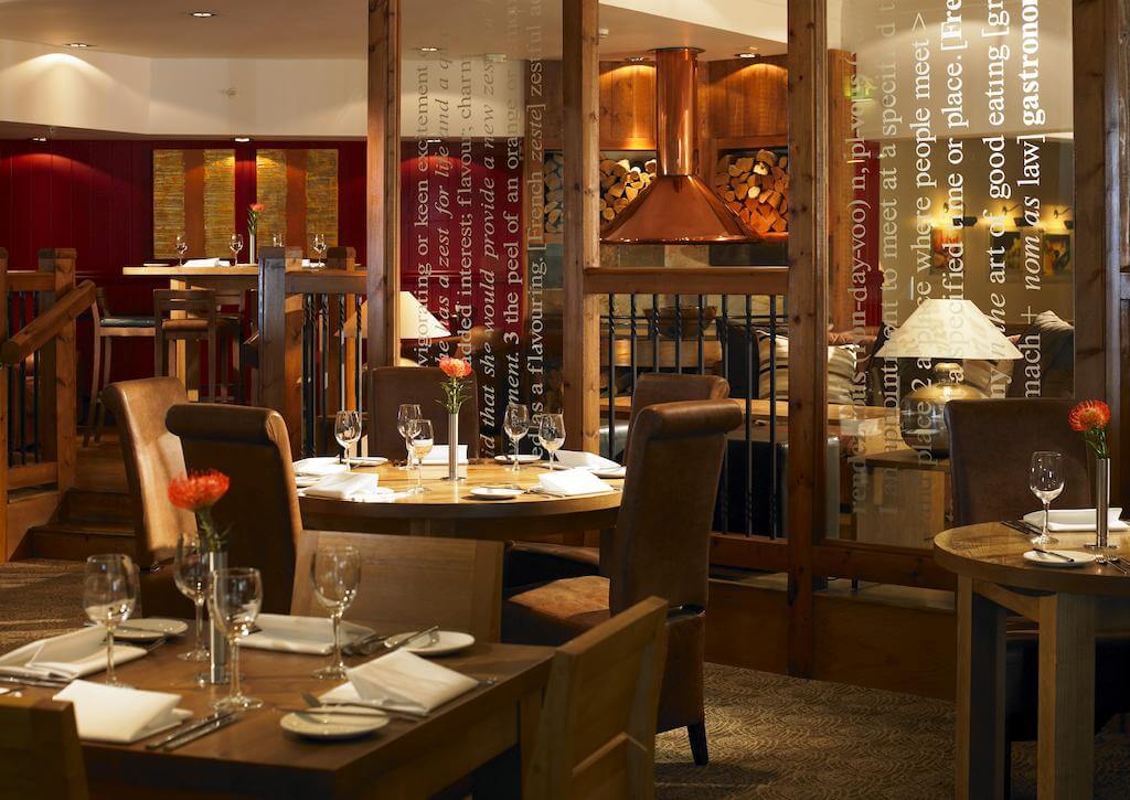 Restaurant with tables set for guests at St Pierre Marriott Hotel and Country Club