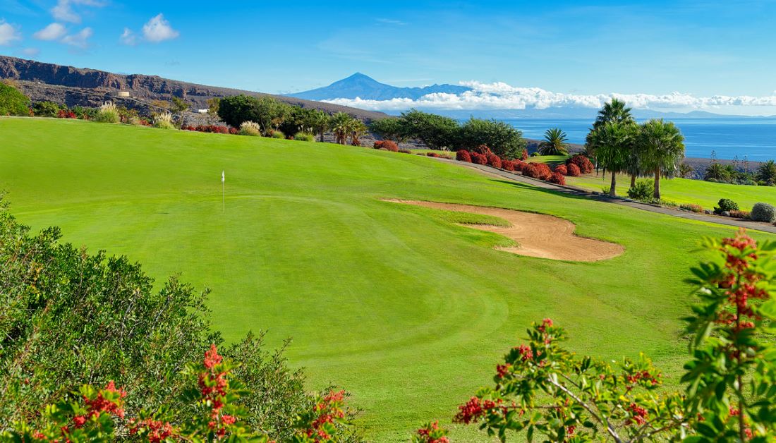 Mountains and blue sky in distance at La Tecina Golf