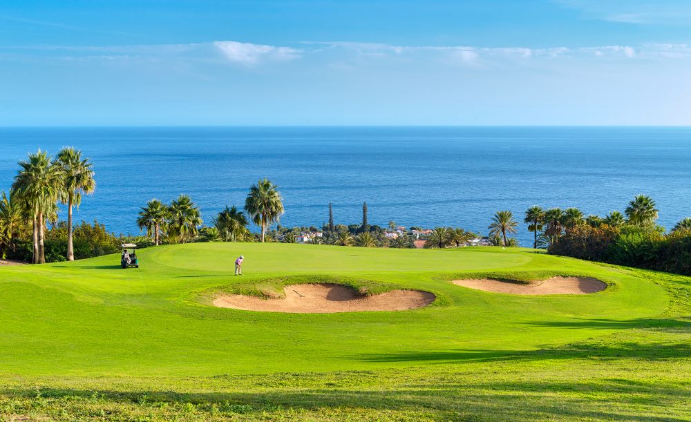 Blue sky and sea beyond the course at Tecina Golf