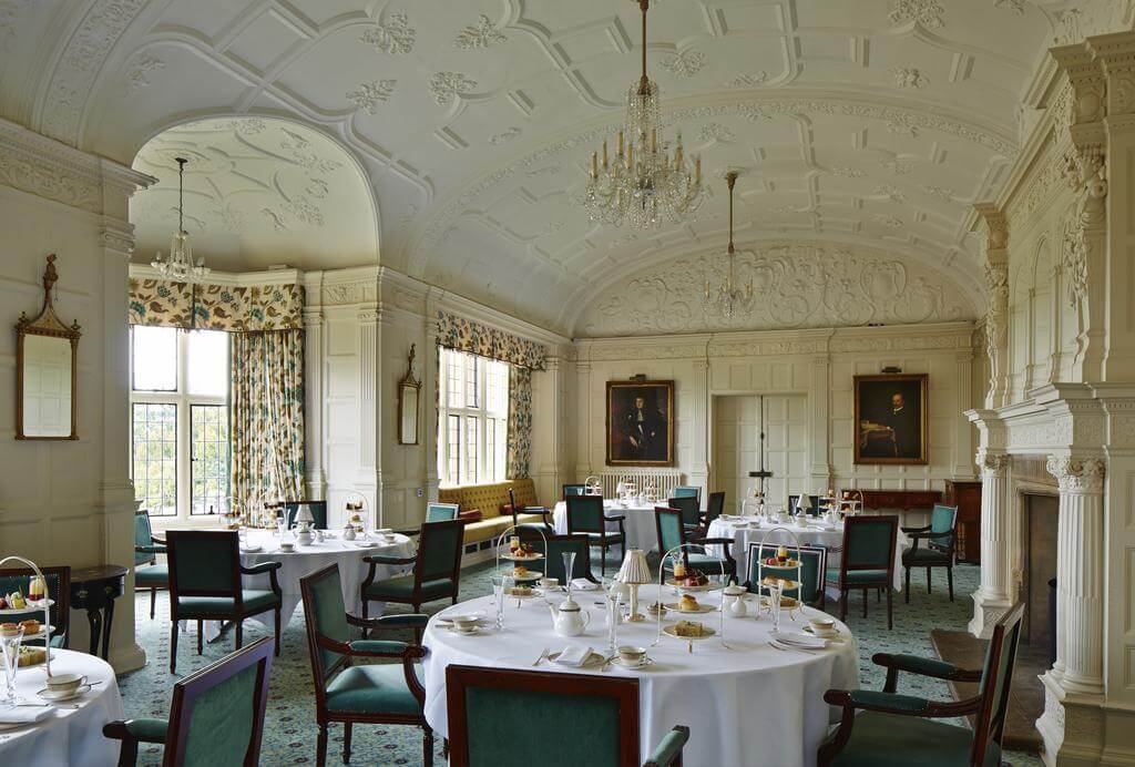 Wood panelled dining room serving afternoon tea at Hanbury Manor Golf Marriott Hotel And Country Club