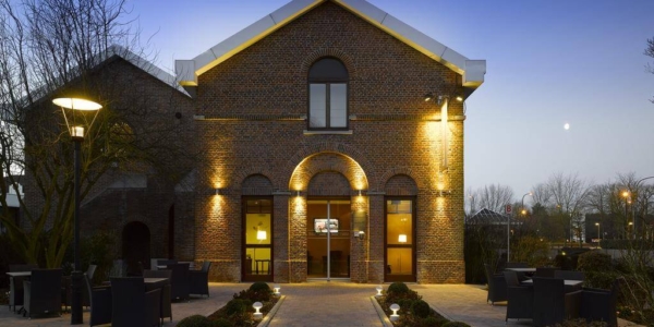 Exterior of Martin's Waterloo at night with lights illuminating the path to the main entrance