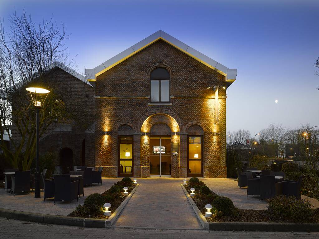 Exterior of Martin's Waterloo at night with lights illuminating the path to the main entrance
