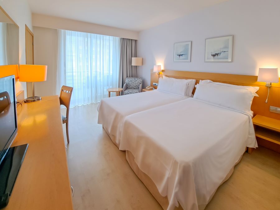 Twin beds in bedroom at Sol Port Cambrils