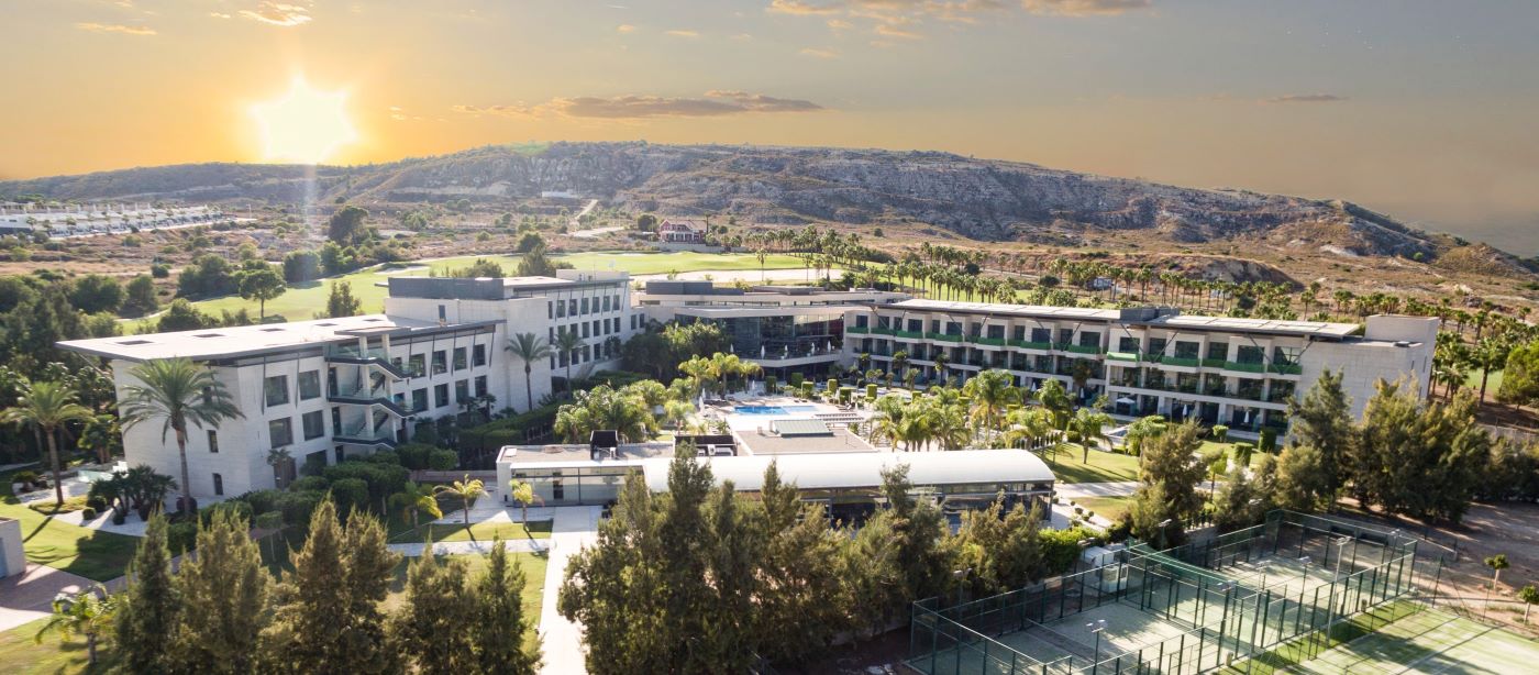 La Finca Golf Resort in Costa Blanca with the sun setting in the background