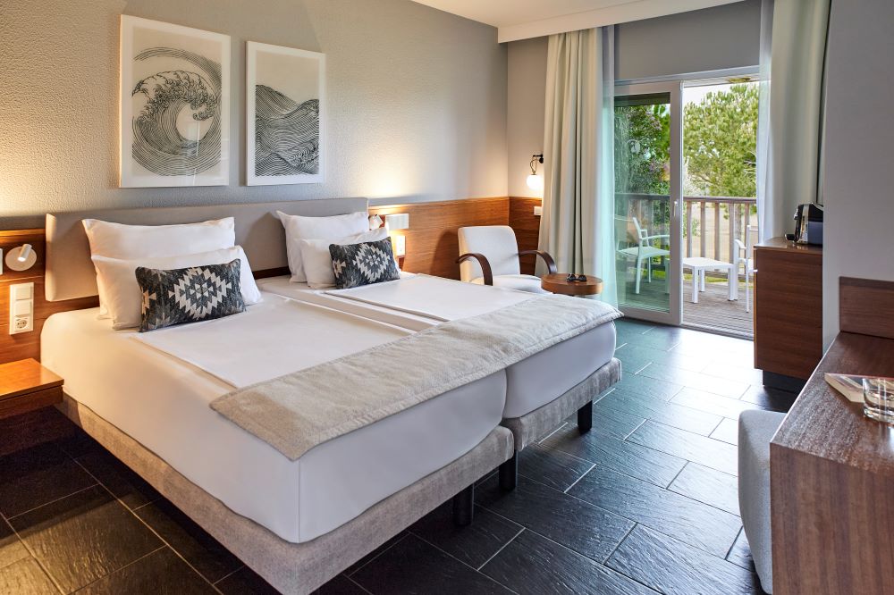 Twin beds with balcony at Robinson Quinta Da Ria resort in Eastern Algarve