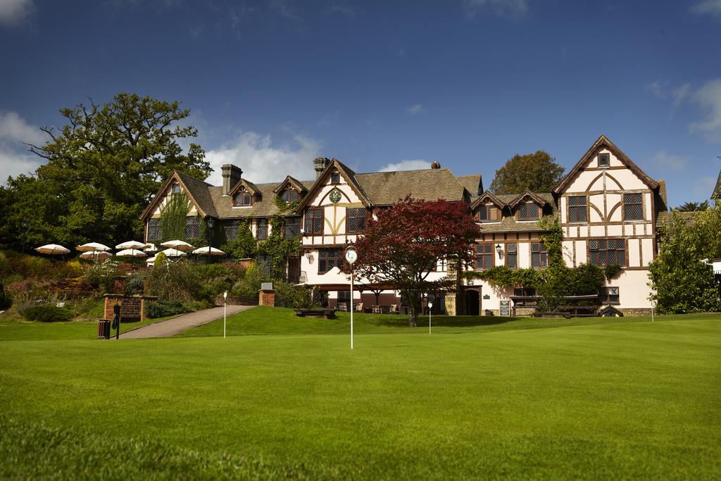 Practice putting green with Mannings Heath Golf & Wine Estate in the background