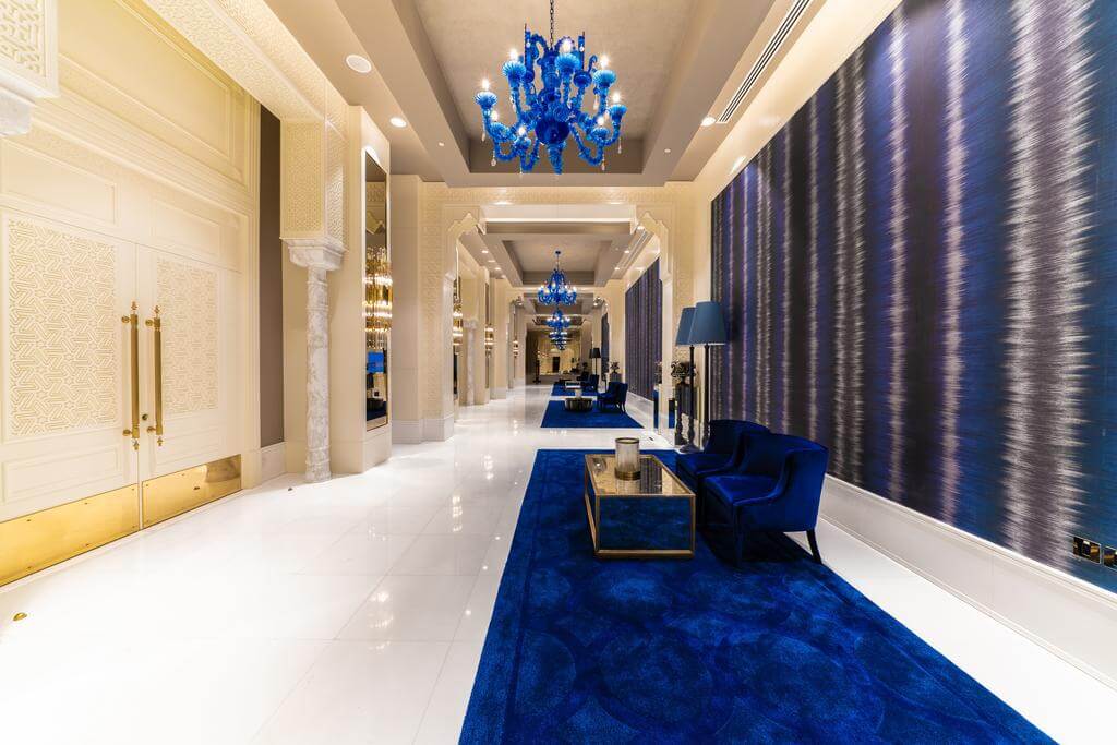 Rixos Premium Saadiyat Island lobby areas with blue carpet and blue sofa and blue chandelier