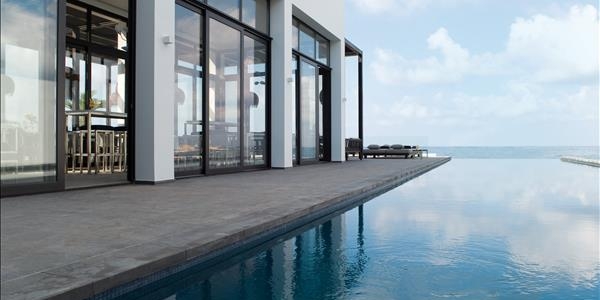 Infinity pool facing the sea at Almyra Hotel in Paphos