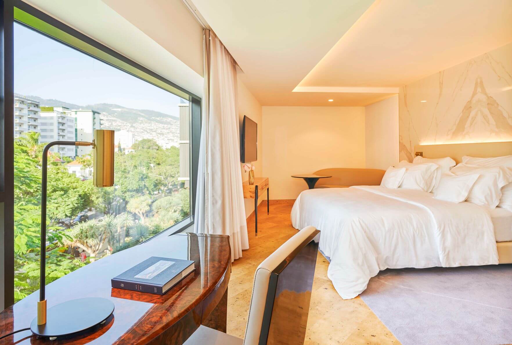 Bedroom at Savoy Palace, Funchal Madeira with lamp, desk, bed and window