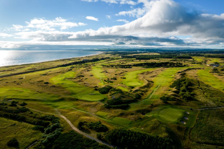 Arial shot of Dundonald Links golf course with blue sea in the distance