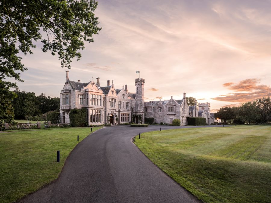 Exterior shot of Roxburghe Hotel & Golf Course with drive through grounds leading to entrance