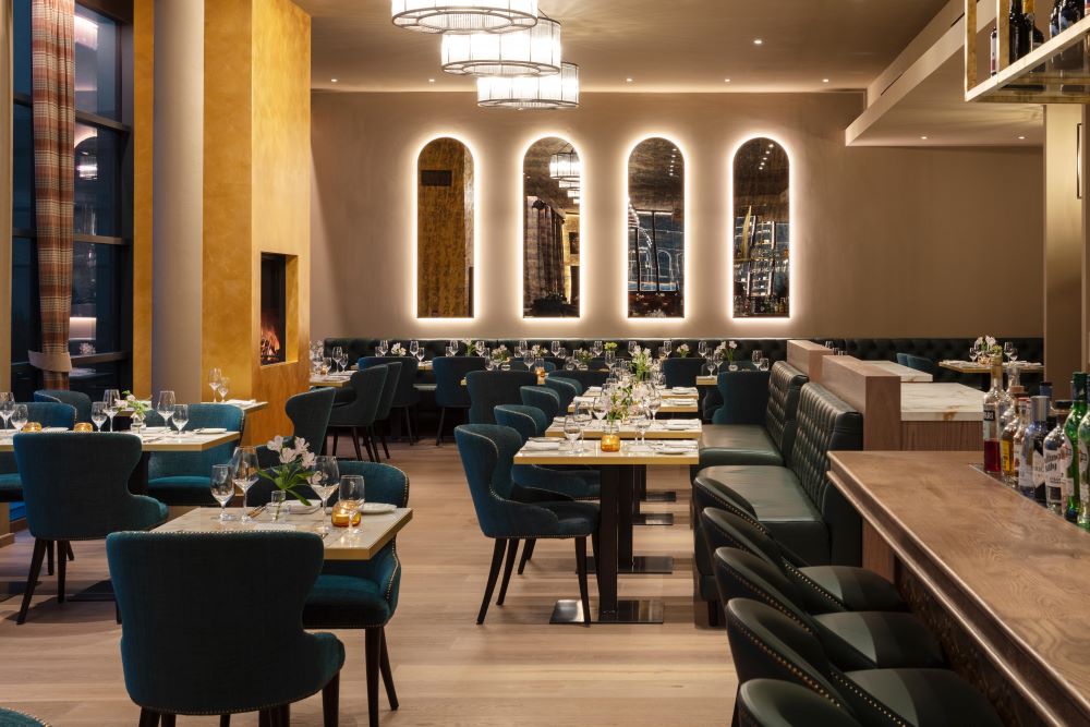 Restaurant with green chairs and tables set at Roxburghe Hotel And Golf Course